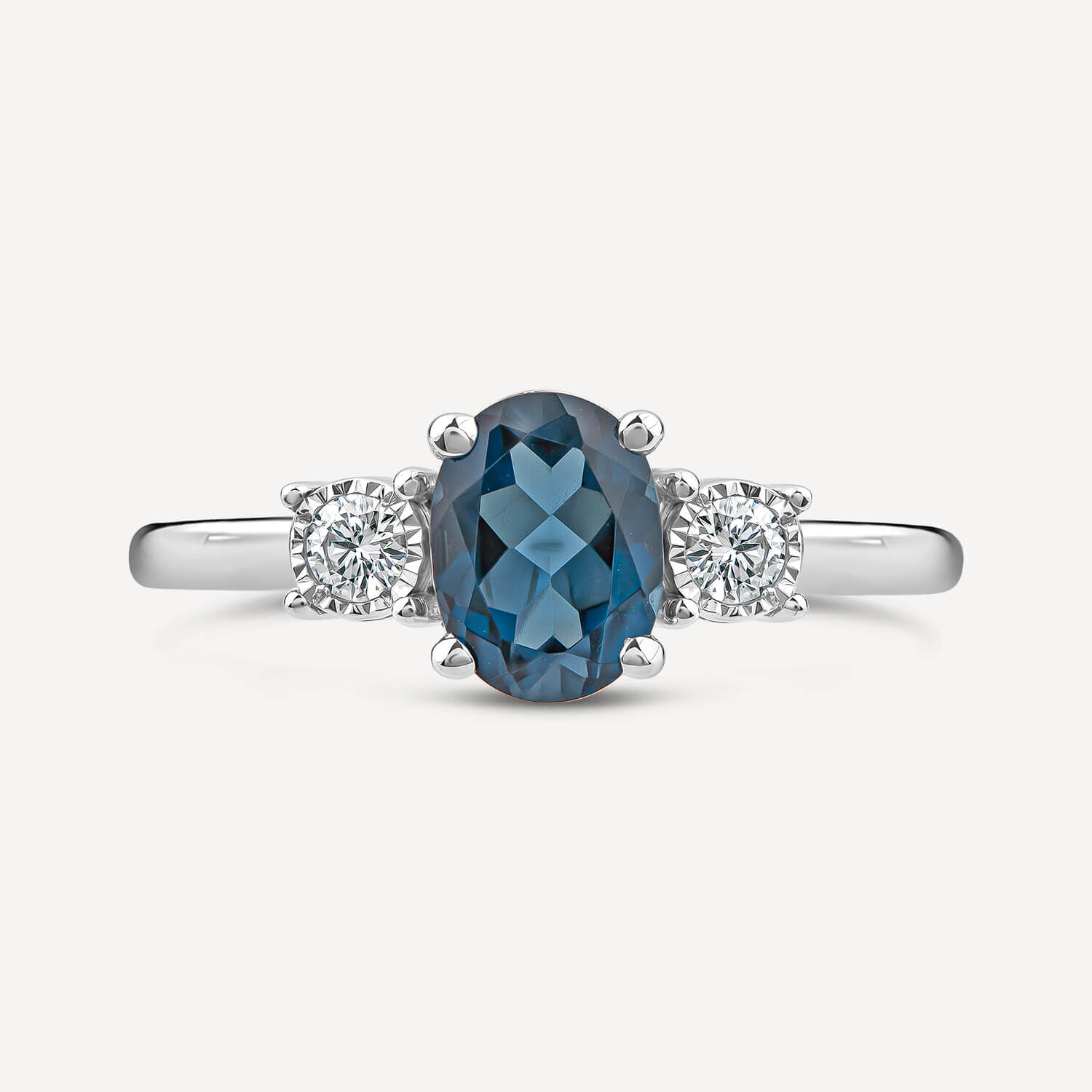 Diamond ring with blue topaz side stones hotsell