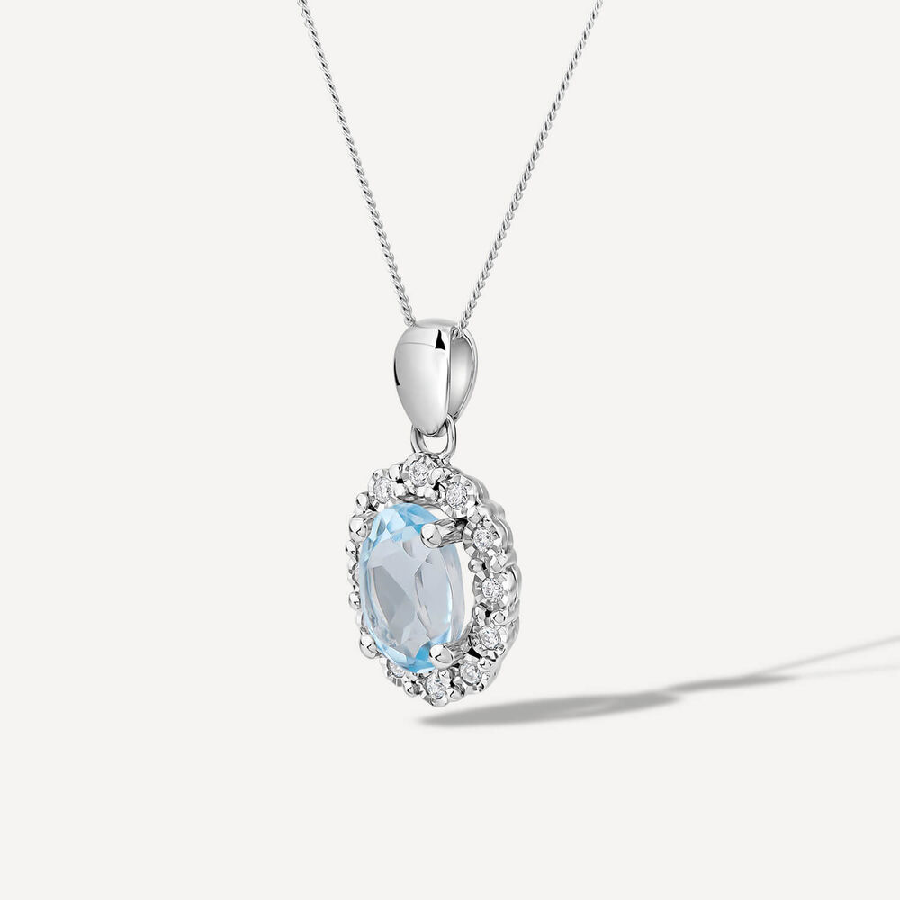 9ct White Gold Oval Blue Topaz 0.05ct Diamond Cluster Pendant