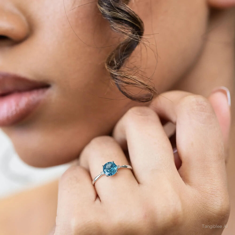 9ct White Gold Diamond and Blue Topaz Round Ring