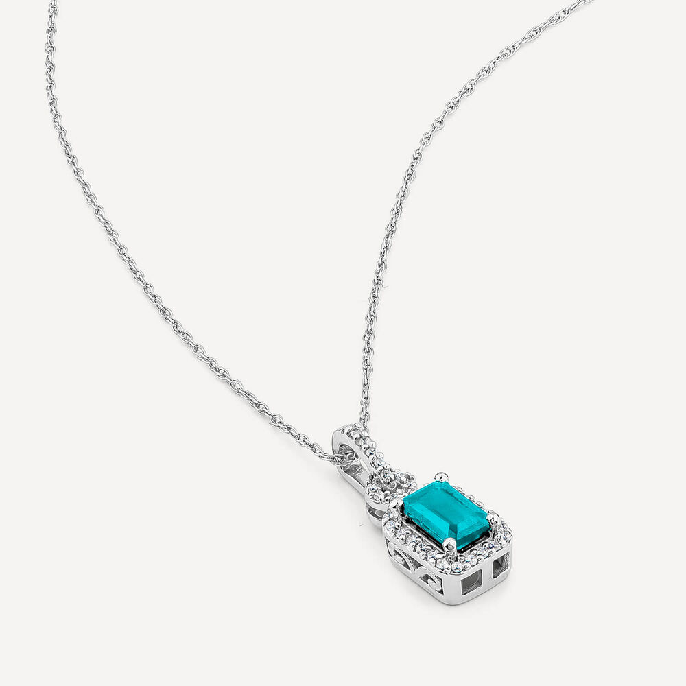 9ct White Gold Rectangular Blue Topaz & 0.10ct Diamond Halo Pendant image number 3