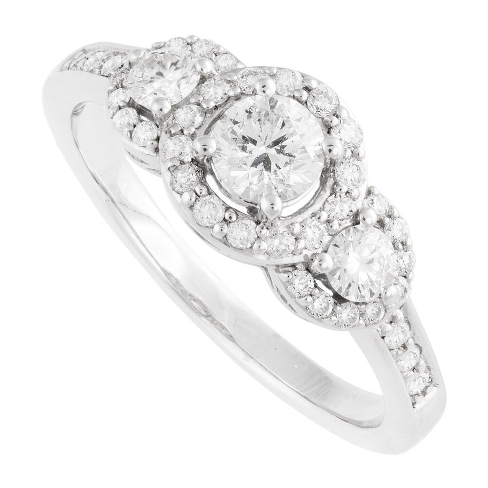18ct white gold 0.75 carat diamond three stone halo ring image number 0