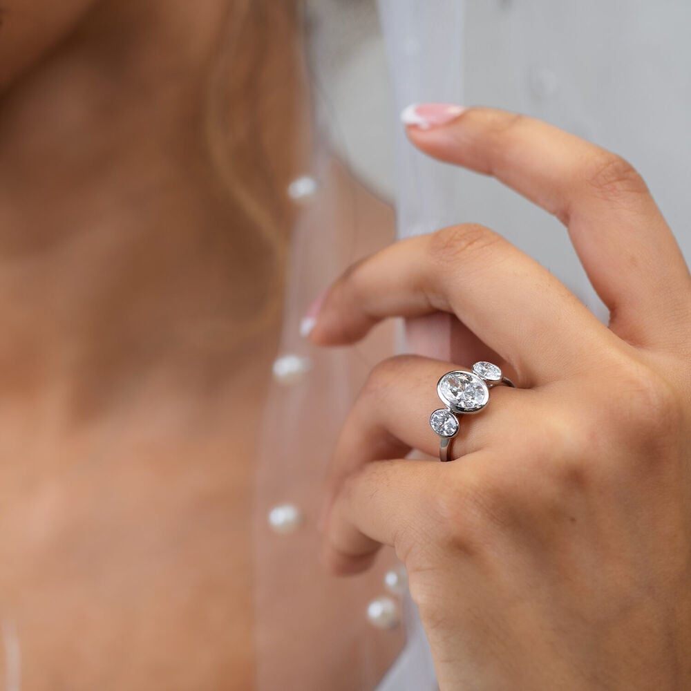 Born Platinum Lab Grown 2.80ct Oval Diamond Three Stone Bezel Set Ring image number 4