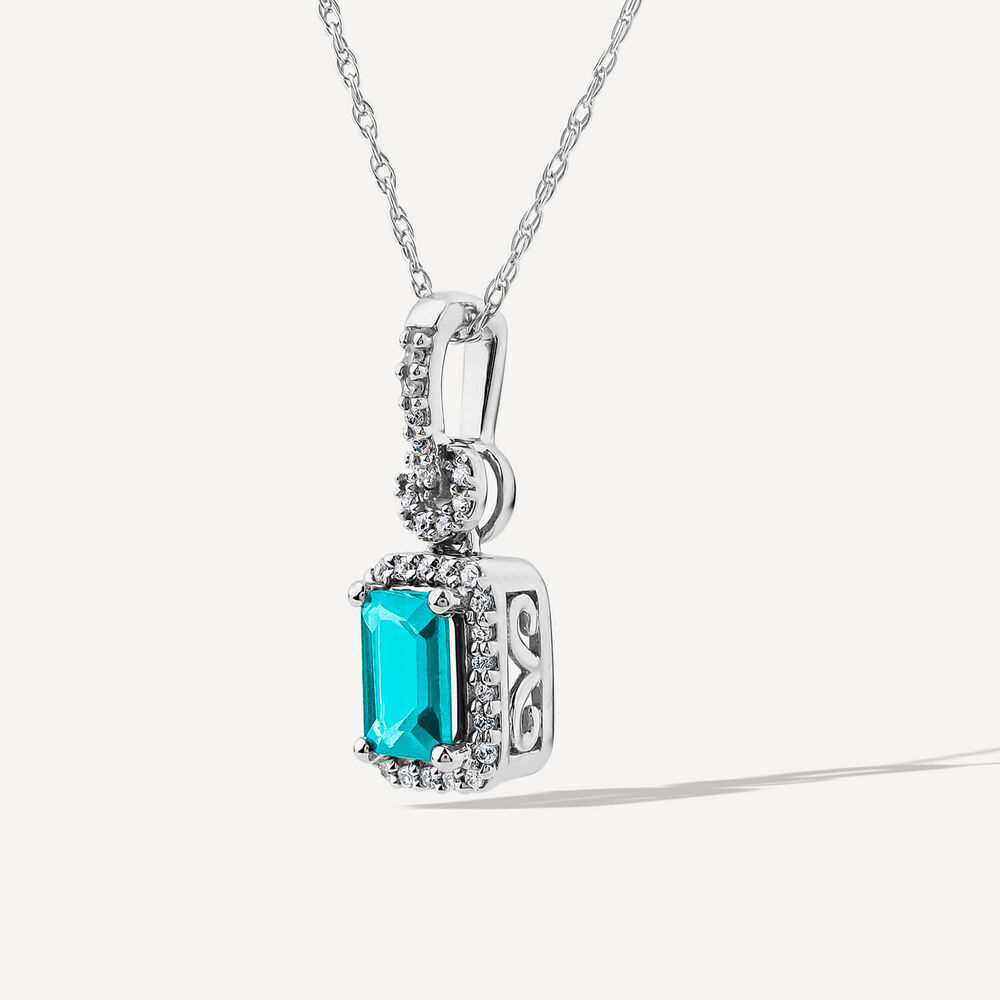 9ct White Gold Rectangular Blue Topaz & 0.10ct Diamond Halo Pendant
