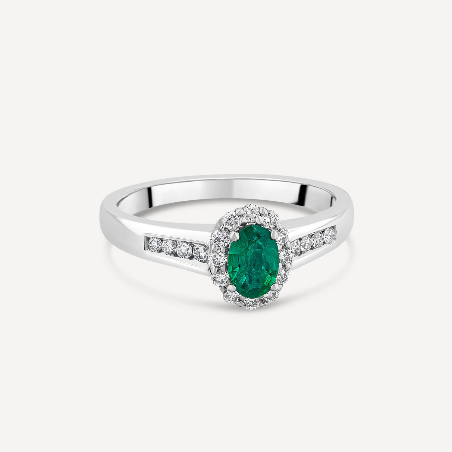 18ct White Gold Oval Emerald 0.25ct Diamond Cluster Channel Shoulders Ring