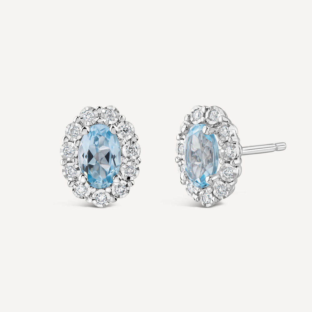 9ct White Gold Oval Blue Topaz Centre 0.05ct Diamond Cluster Stud Earrings